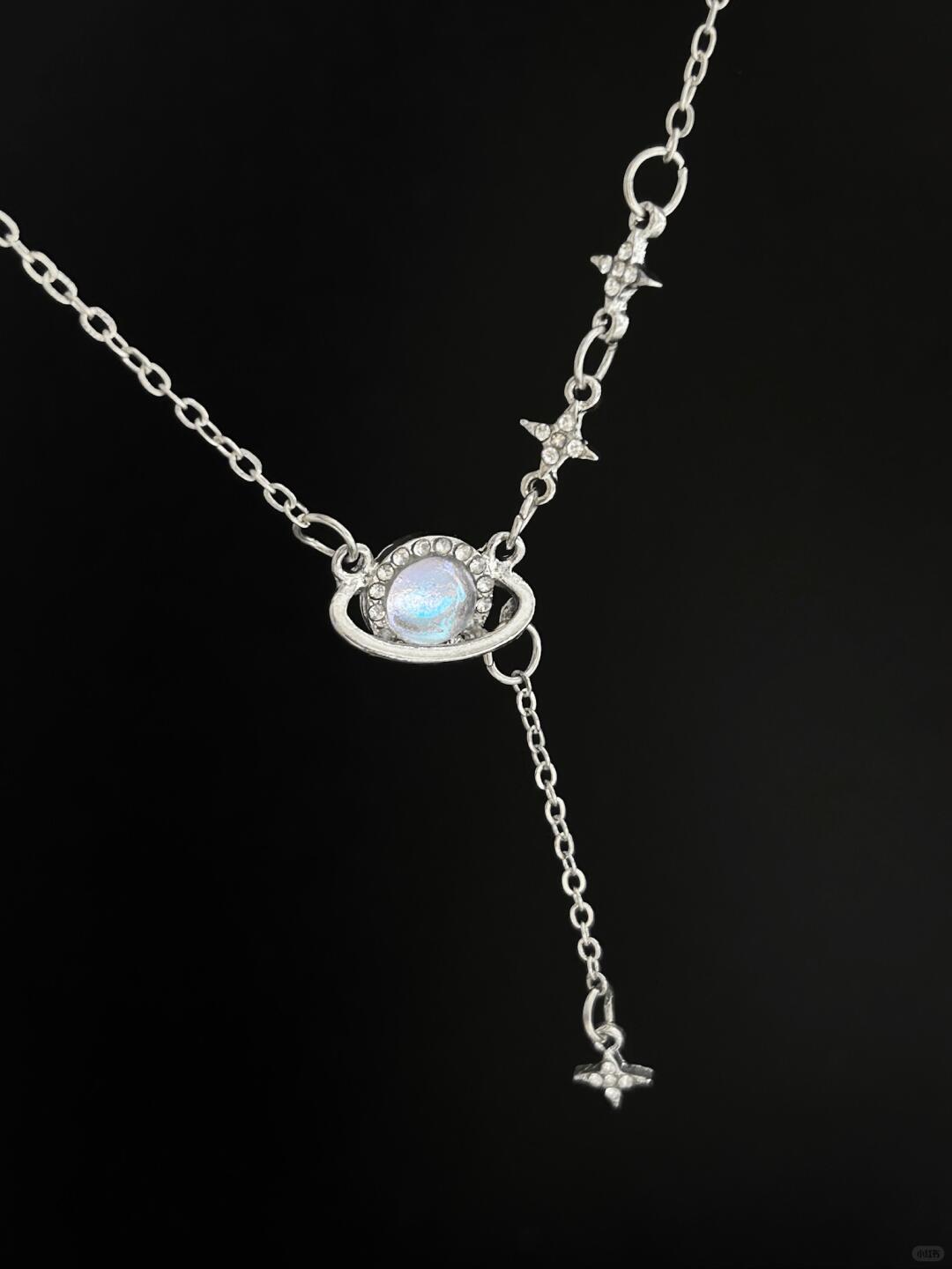 Discover the Astro Dust Necklace, inspired by the beauty of nebulae and the light of humanity. A celestial accessory that symbolizes connection and love. Limited to 13 pieces. Shop now at Y2Bling.