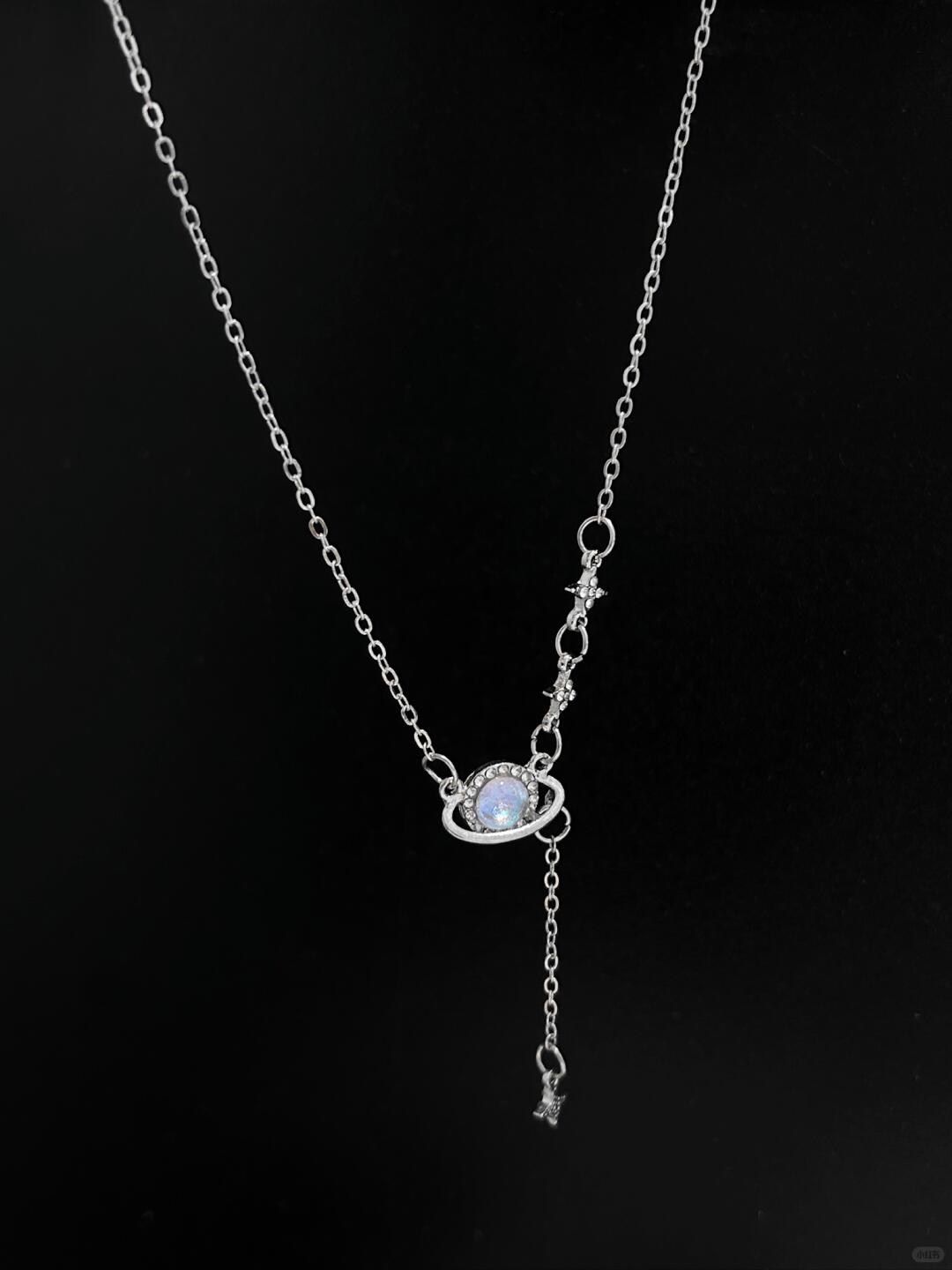 Discover the Astro Dust Necklace, inspired by the beauty of nebulae and the light of humanity. A celestial accessory that symbolizes connection and love. Limited to 13 pieces. Shop now at Y2Bling.